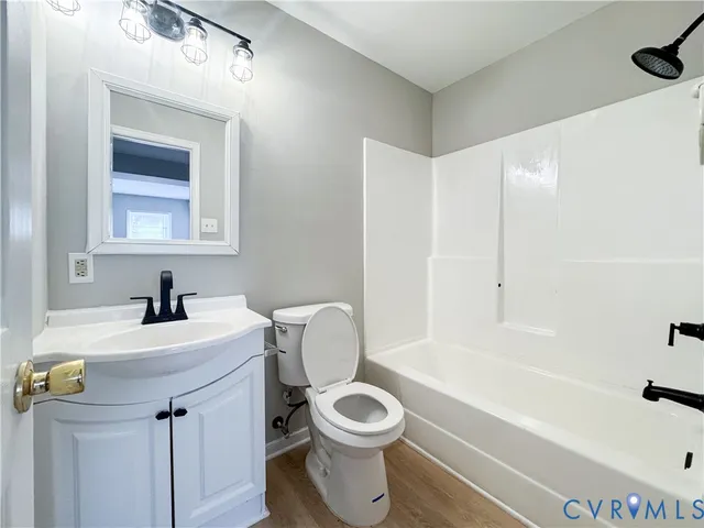 a bathroom with a sink a toilet and a bathtub