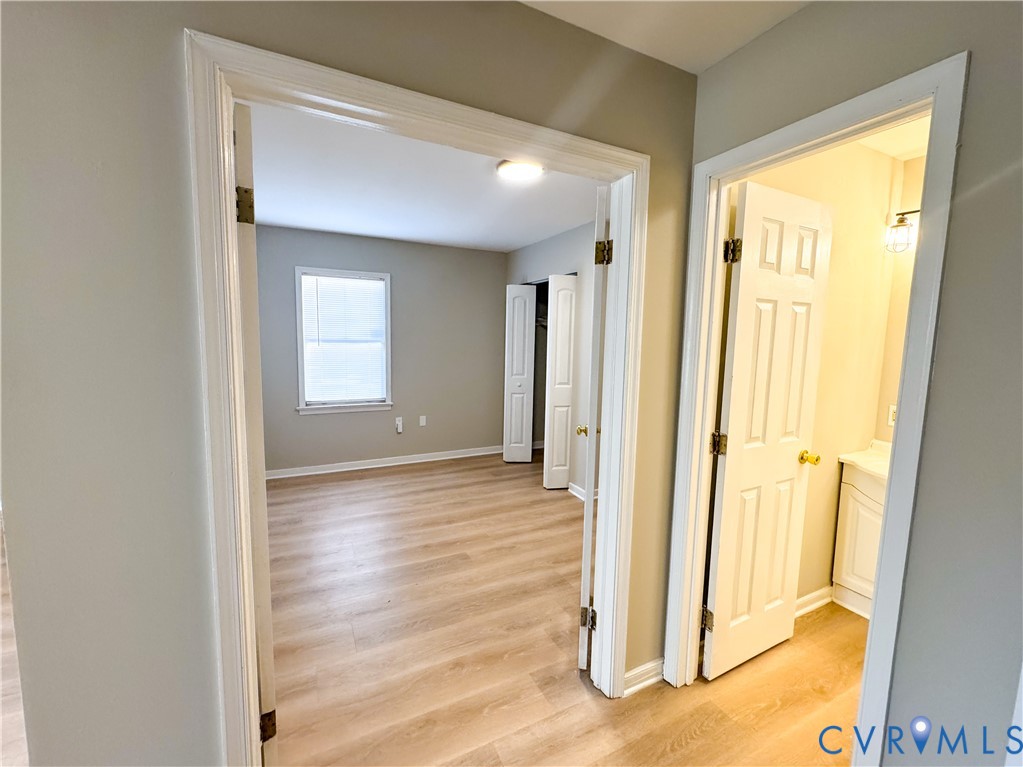 1706 Hungary Road Henrico, VA 23228 - Photo 16 of 28 a view of a bathroom with wooden floor and a bathroom