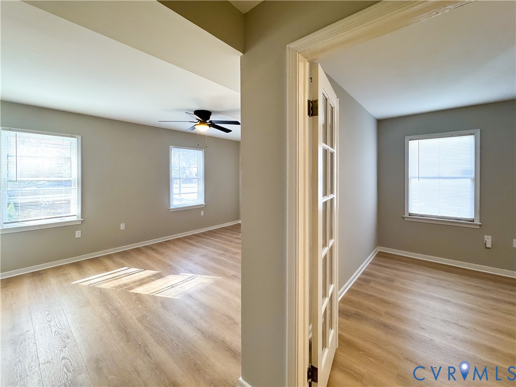 1706 Hungary Road Henrico, VA 23228 - Photo 17 of 28 a view of an empty room with wooden floor and a window