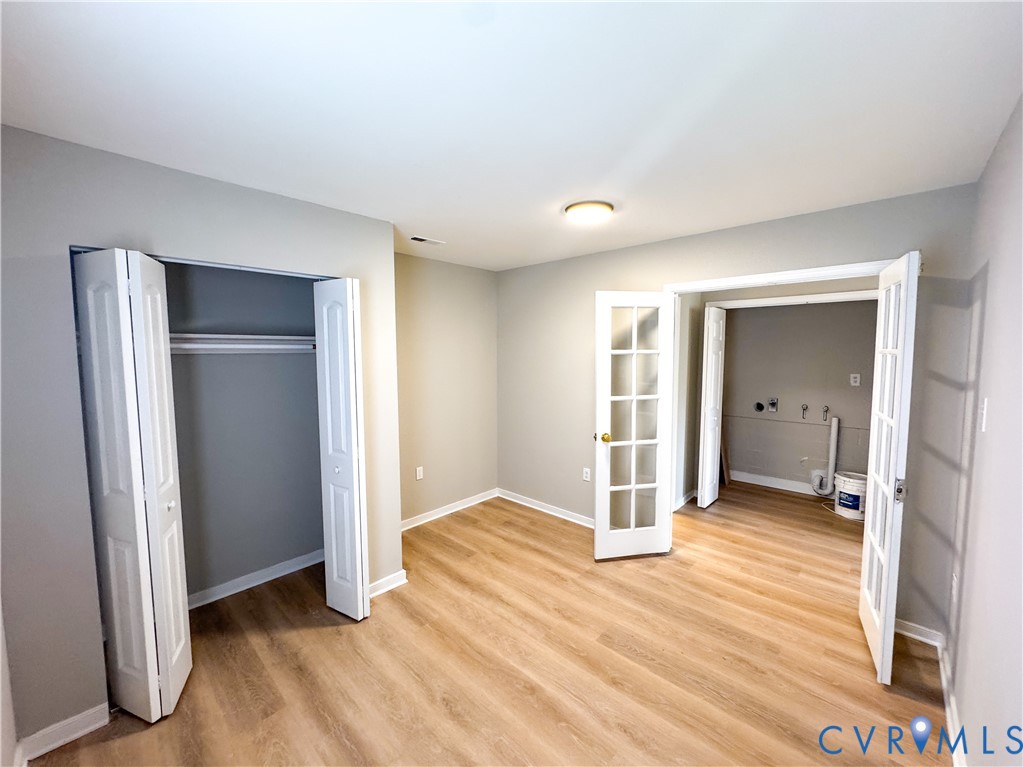 1706 Hungary Road Henrico, VA 23228 - Photo 19 of 28 a view of a livingroom with wooden floor and a bathroom