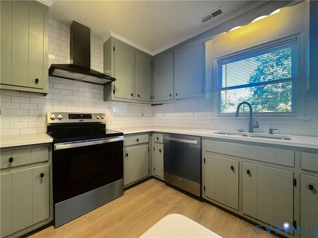 a kitchen with a sink and cabinets