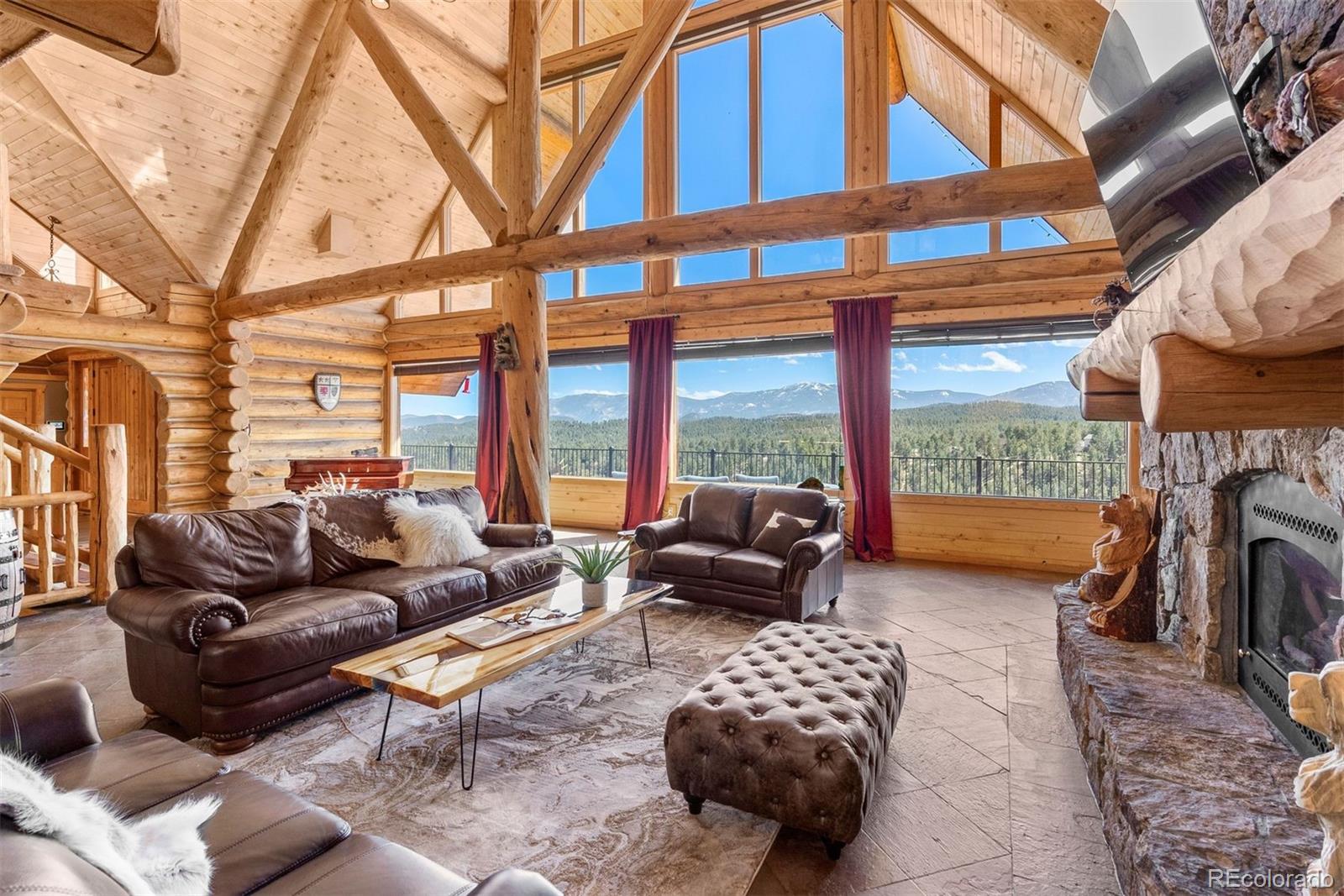 217 North Hill Drive Bailey, CO 80421 - Photo 13 of 49 a outdoor living space with patio furniture and a fireplace