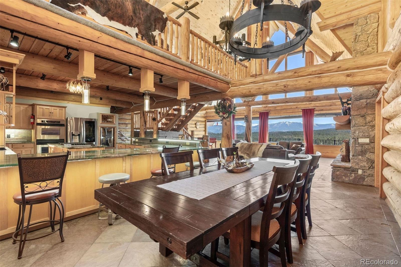217 North Hill Drive Bailey, CO 80421 - Photo 15 of 49 a outdoor dining area with a table and chairs