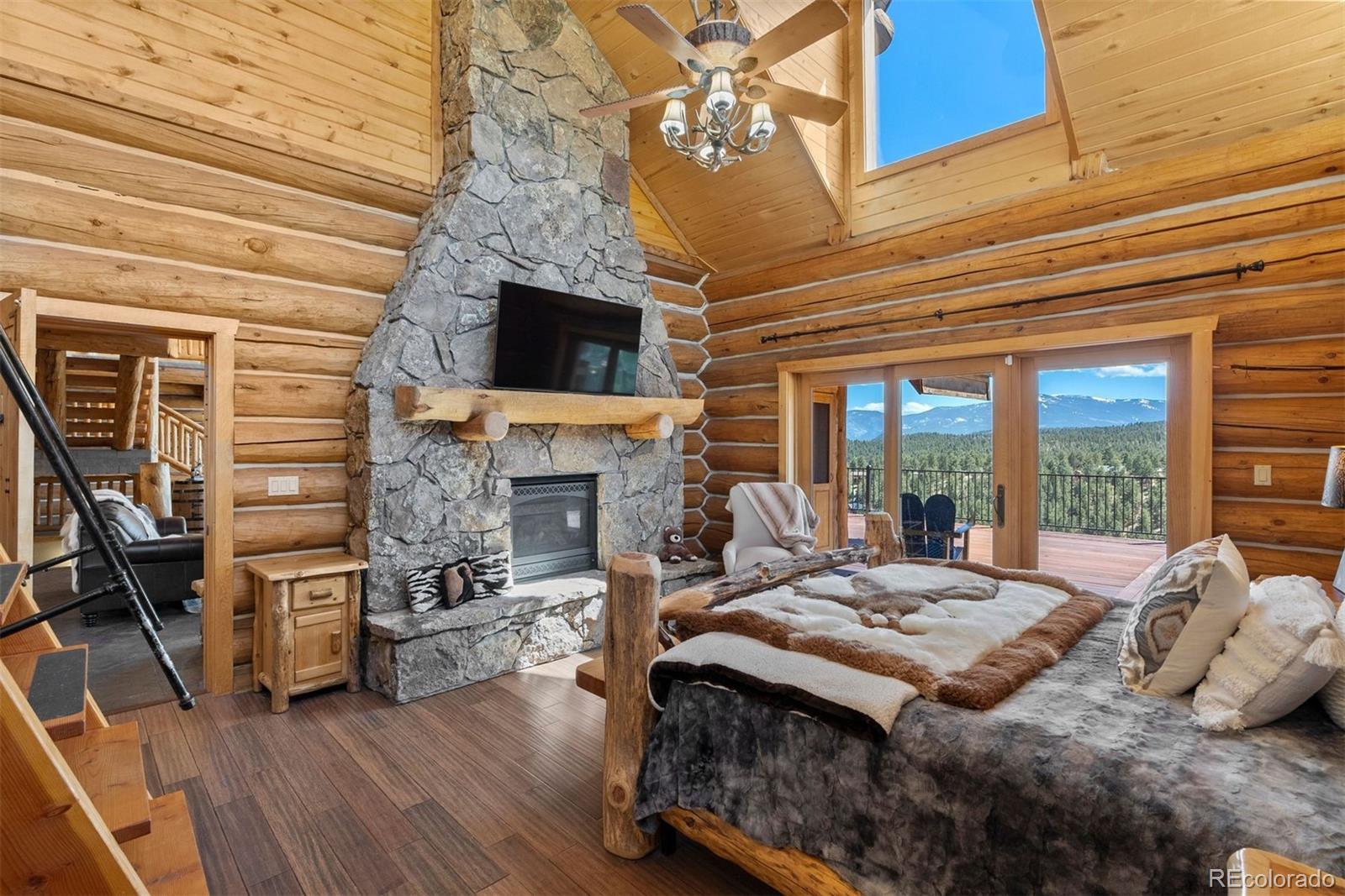 217 North Hill Drive Bailey, CO 80421 - Photo 19 of 49 a view of a livingroom with furniture and a fireplace