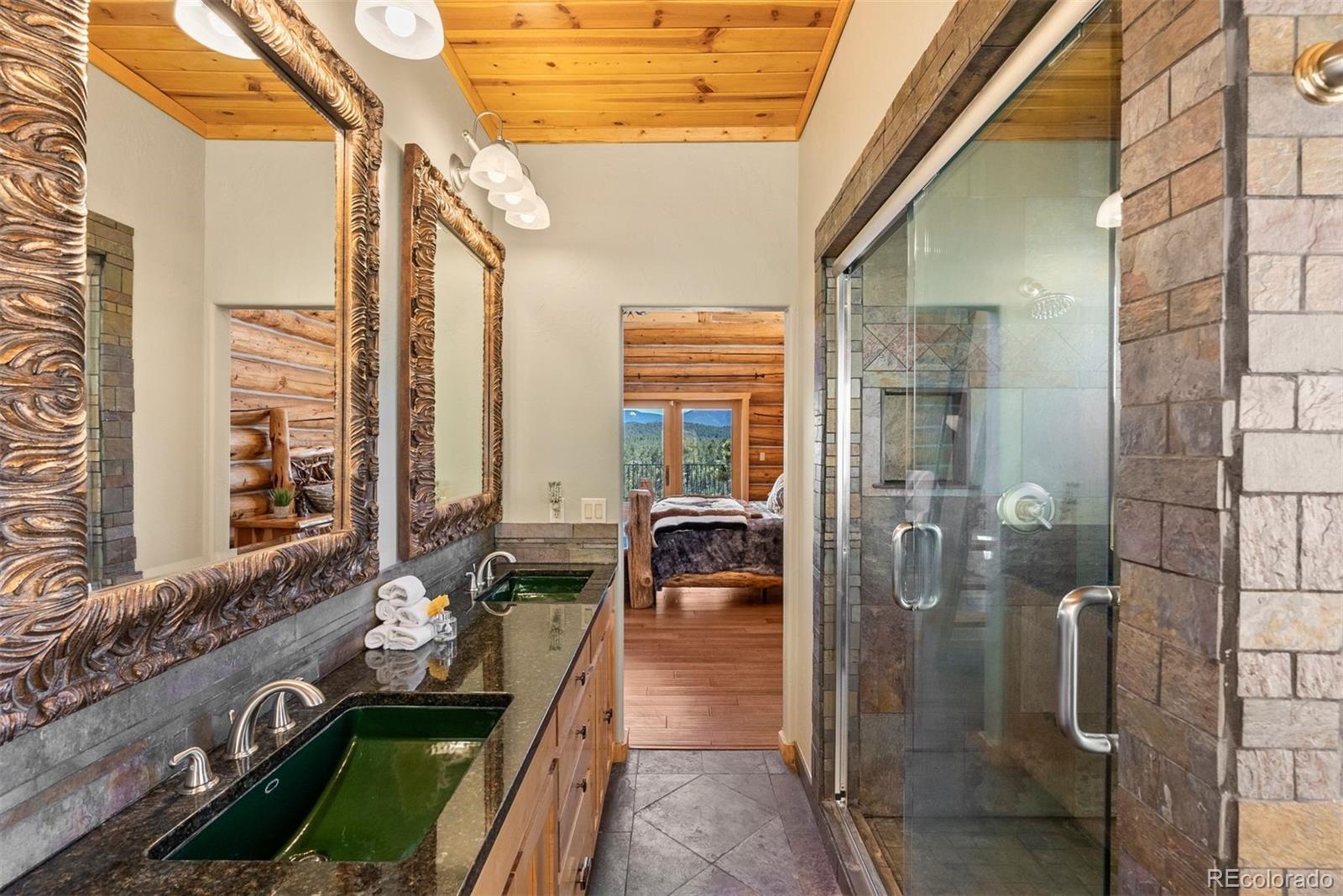 217 North Hill Drive Bailey, CO 80421 - Photo 22 of 49 a front view of a house with outdoor seating