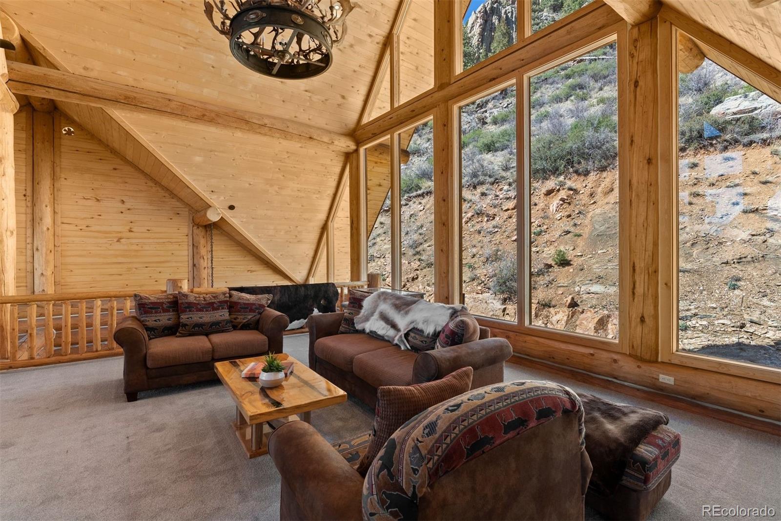 217 North Hill Drive Bailey, CO 80421 - Photo 31 of 49 a living room with furniture and a large window