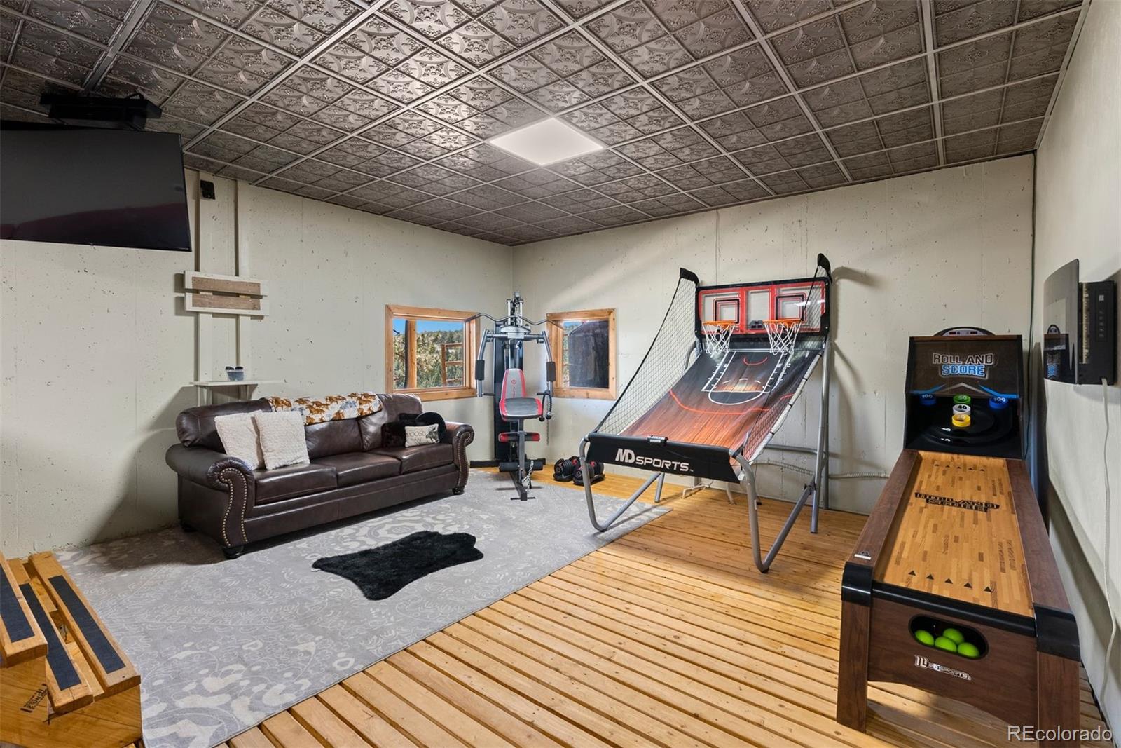 217 North Hill Drive Bailey, CO 80421 - Photo 38 of 49 a living room with furniture and a wooden floor
