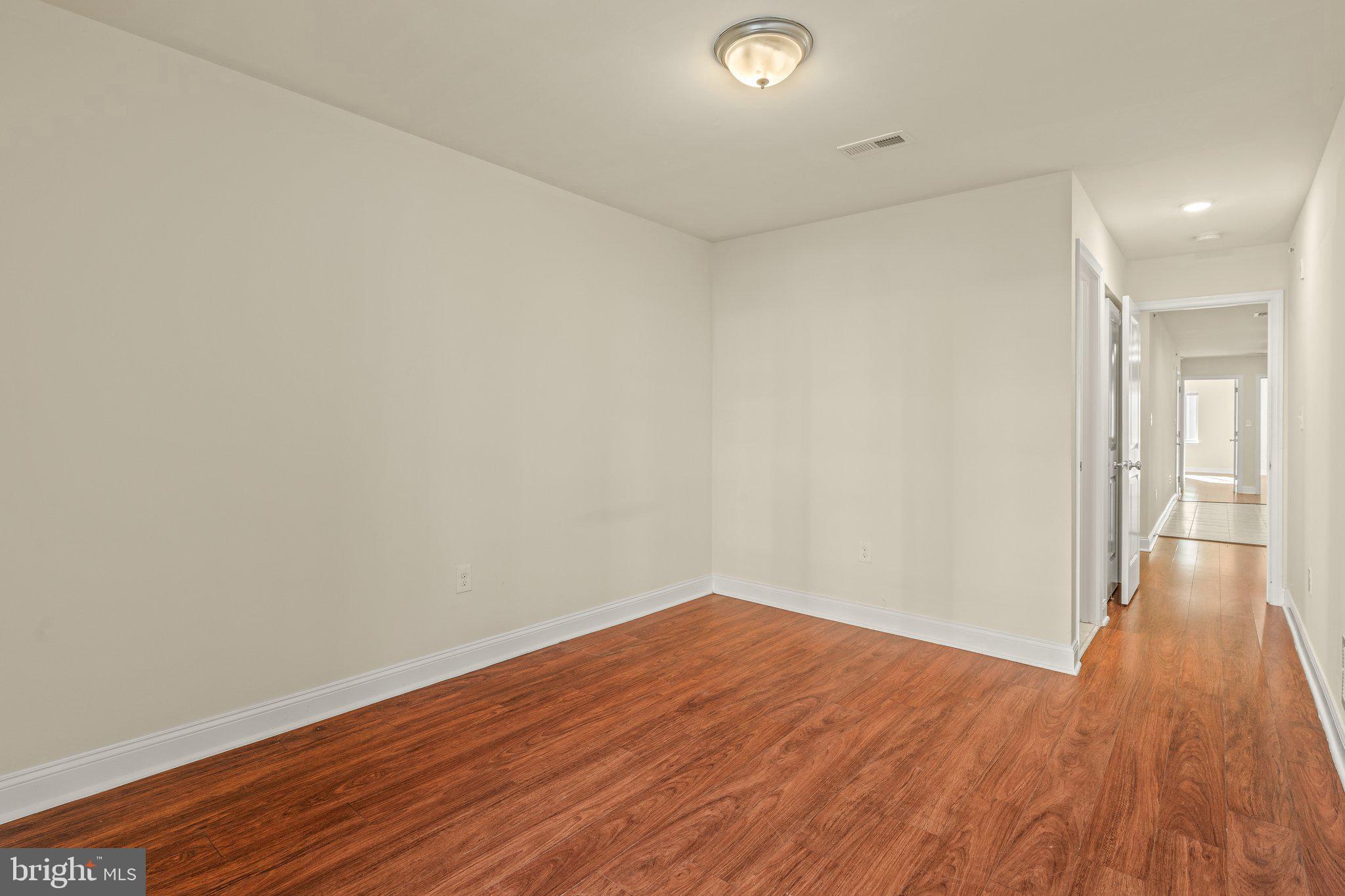 1724 Master Street, Unit C Philadelphia, PA 19121 - Photo 14 of 24 a view of an empty room with wooden floor