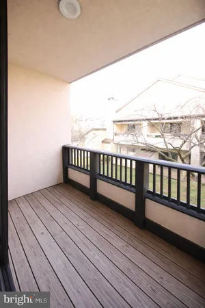 a view of a balcony with wooden floor