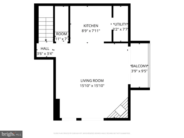 a picture of a bench in front of a wall