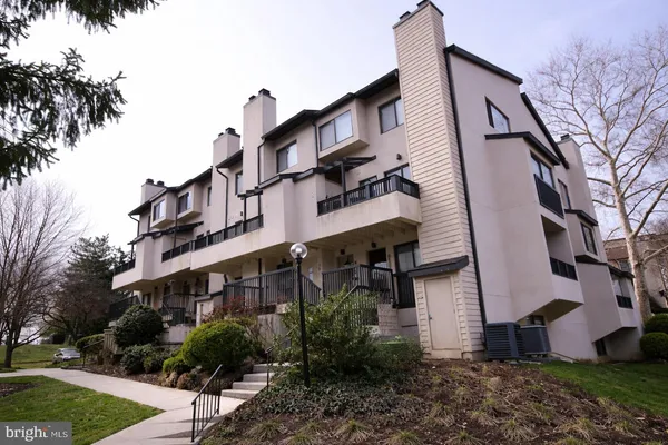a view of a building with a yard