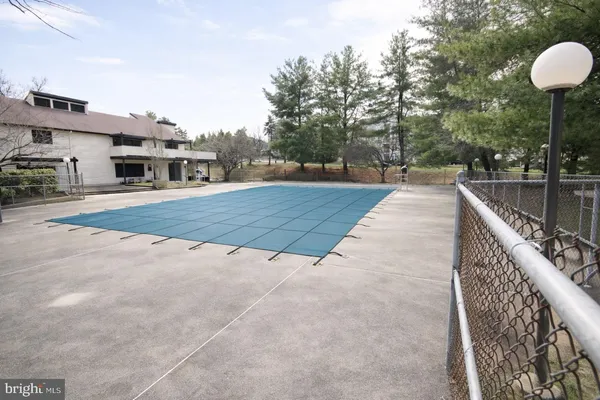 a view of a field with basketball court