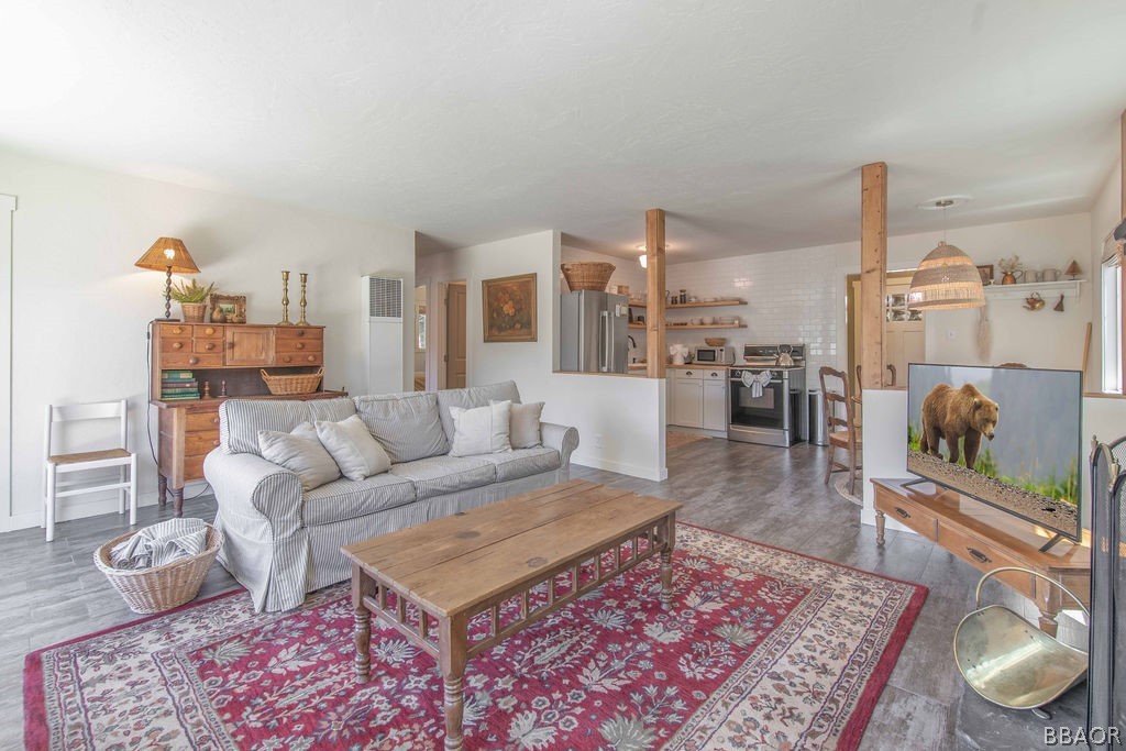 42897 Encino Road Big Bear Lake, CA 92315 - Photo 20 of 45 a living room with furniture and a rug