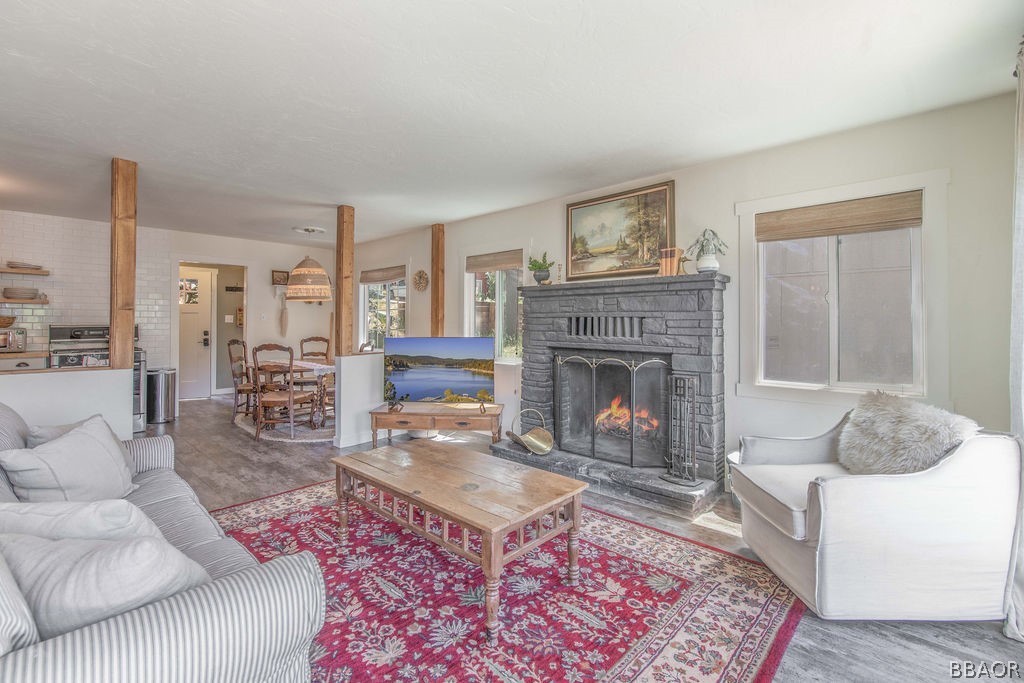 42897 Encino Road Big Bear Lake, CA 92315 - Photo 21 of 45 a living room with furniture and a fireplace