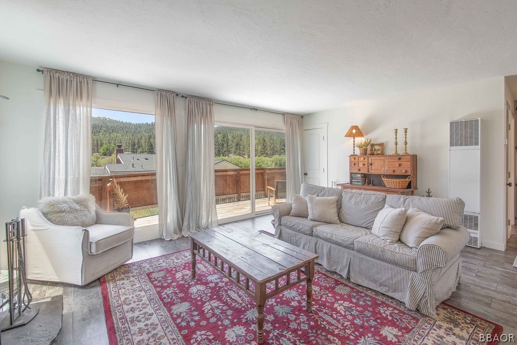 42897 Encino Road Big Bear Lake, CA 92315 - Photo 23 of 45 a living room with furniture and a large window