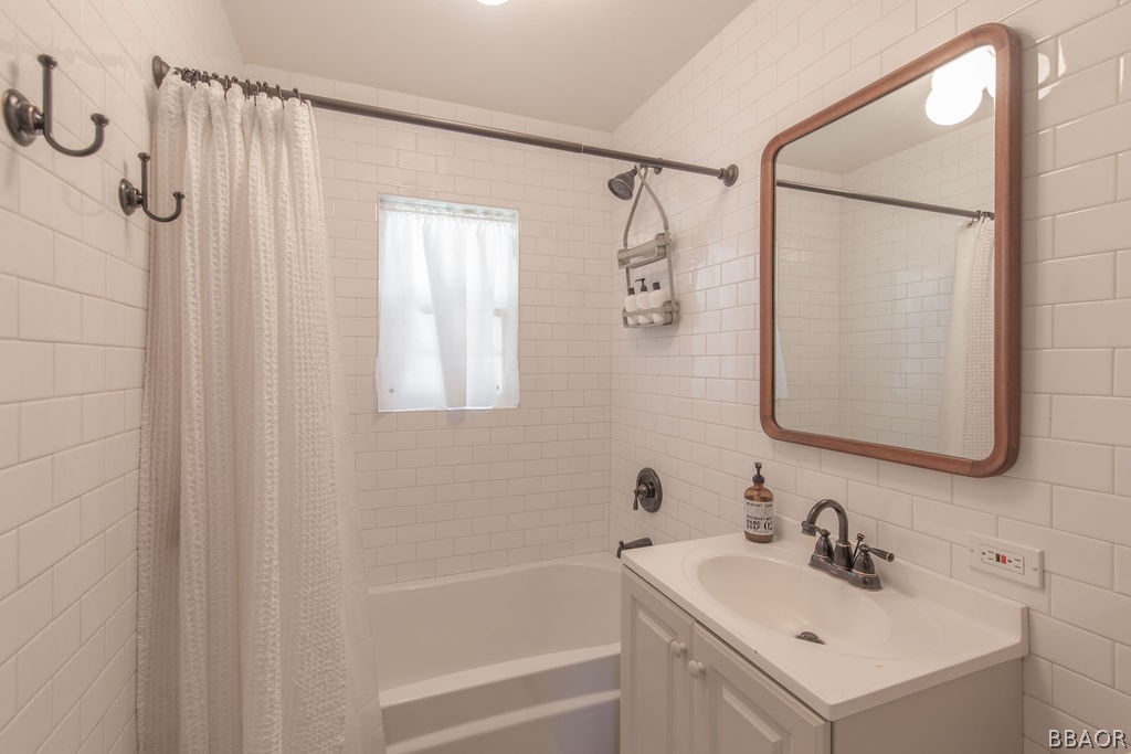 42897 Encino Road Big Bear Lake, CA 92315 - Photo 25 of 45 a bathroom with a sink and a mirror