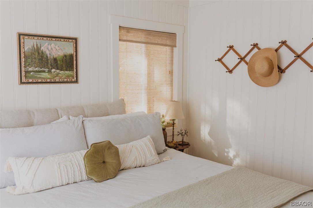 42897 Encino Road Big Bear Lake, CA 92315 - Photo 29 of 45 a bedroom with a bed and a painting on the wall