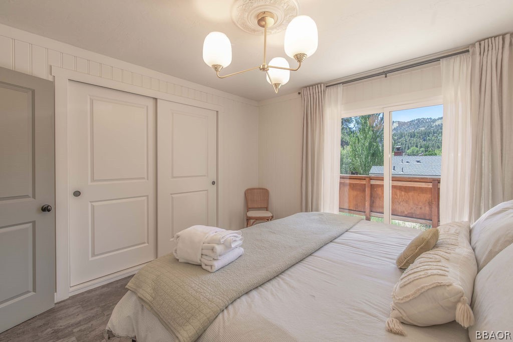42897 Encino Road Big Bear Lake, CA 92315 - Photo 32 of 45 a bedroom with a large bed and a window