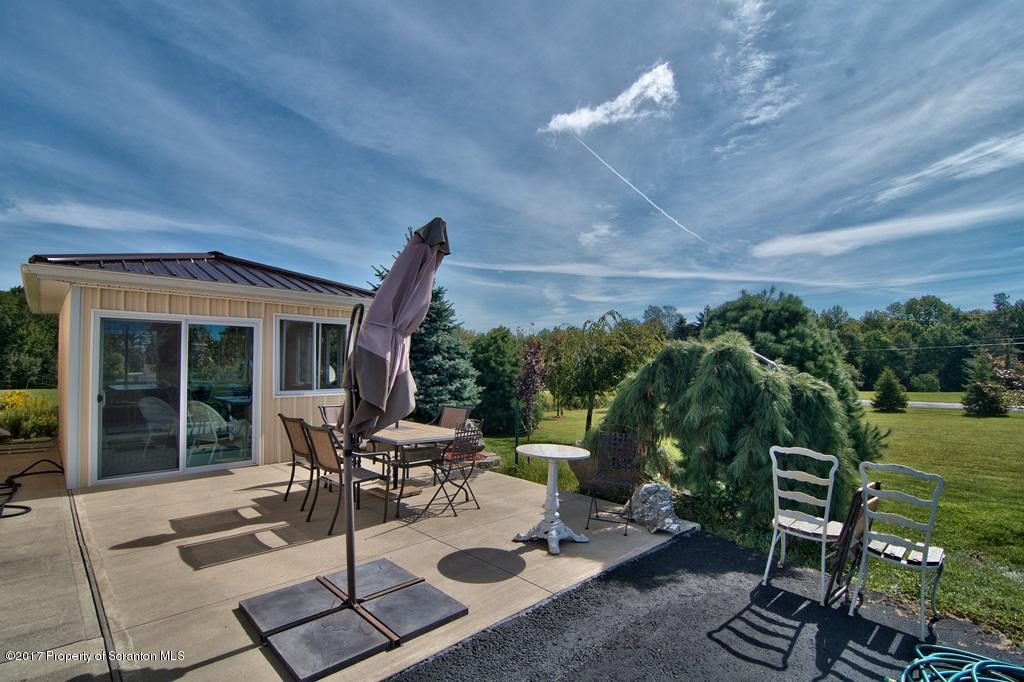 2325 Aberdeen Road Moscow, PA 18444 - Photo 23 of 43 a view of a patio with table and chairs and potted plants