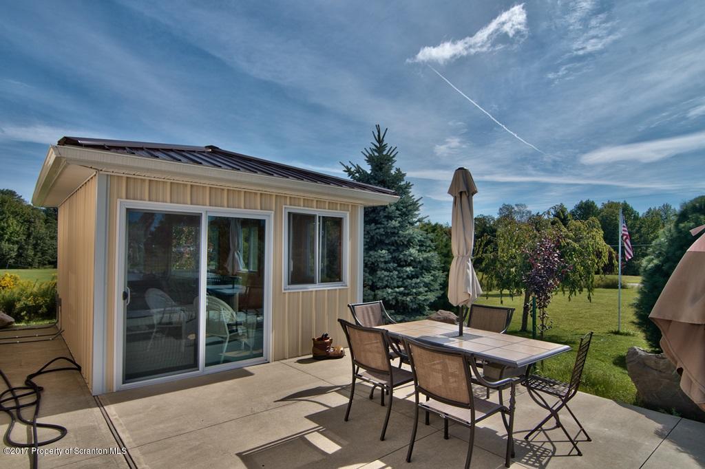 2325 Aberdeen Road Moscow, PA 18444 - Photo 24 of 43 a view of a patio with table and chairs and potted plants