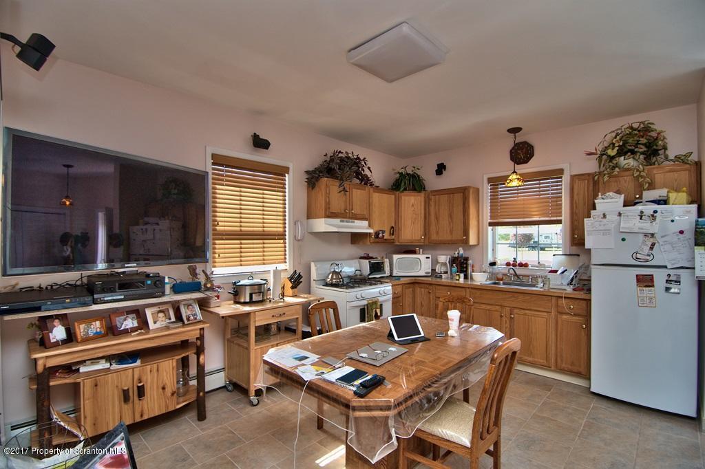 2325 Aberdeen Road Moscow, PA 18444 - Photo 4 of 43 a kitchen with stainless steel appliances granite countertop a stove and a refrigerator