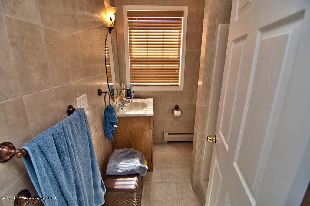 2325 Aberdeen Road Moscow, PA 18444 - Photo 9 of 43 a bathroom with sink a toilet and shower