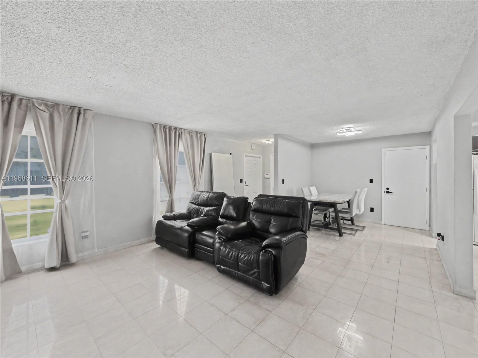 10491 Southwest 122nd Court Miami, FL 33186 - Photo 12 of 25 a living room with furniture