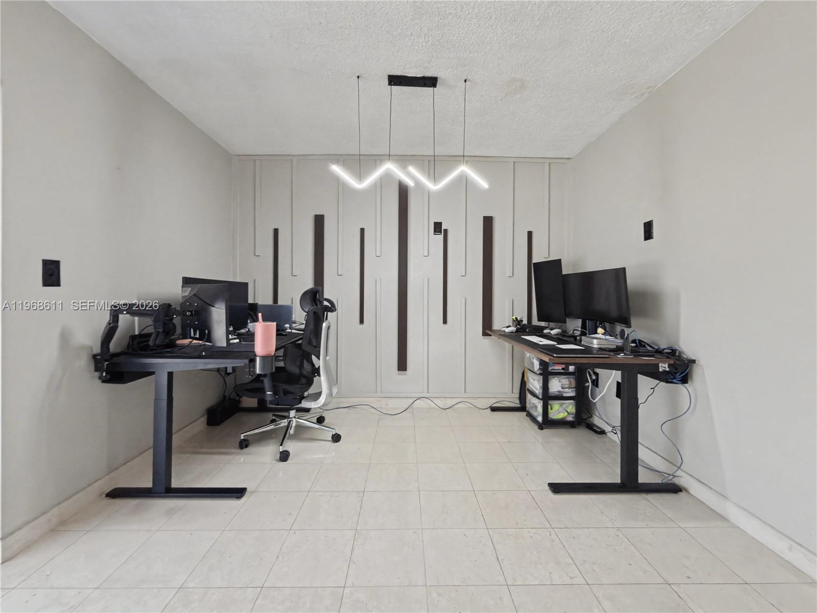 10491 Southwest 122nd Court Miami, FL 33186 - Photo 13 of 25 a view of a workspace with furniture and a window