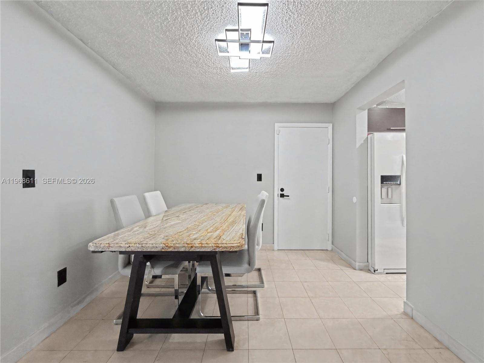 10491 Southwest 122nd Court Miami, FL 33186 - Photo 5 of 25 a workspace with furniture and window