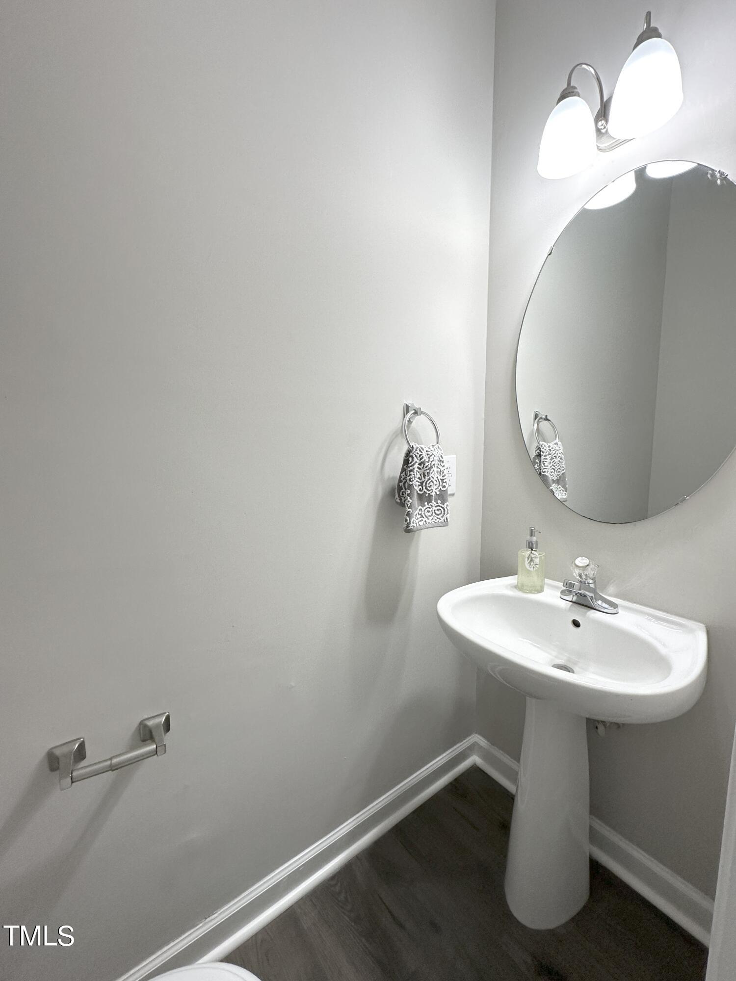 3847 Pin Oak Road Raleigh, NC 27604 - Photo 12 of 22 a bathroom with a sink and a mirror
