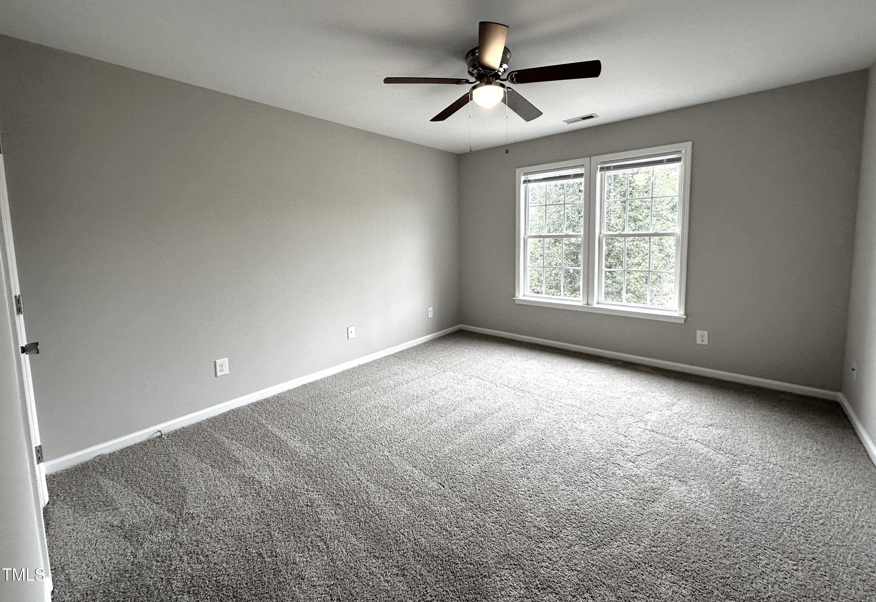 3847 Pin Oak Road Raleigh, NC 27604 - Photo 17 of 22 a view of an empty room with a window