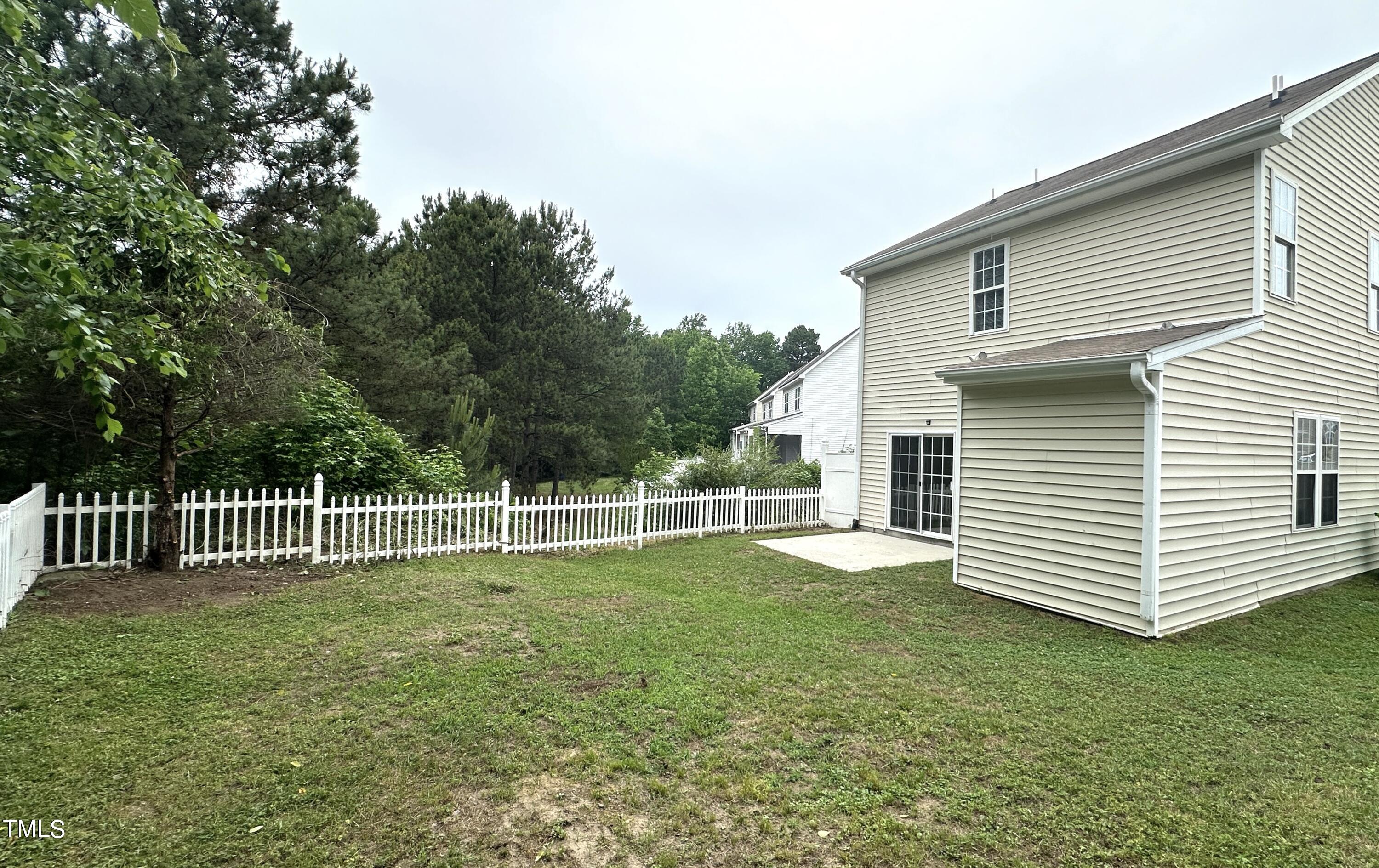 3847 Pin Oak Road Raleigh, NC 27604 - Photo 20 of 22 a front view of a house with a garden
