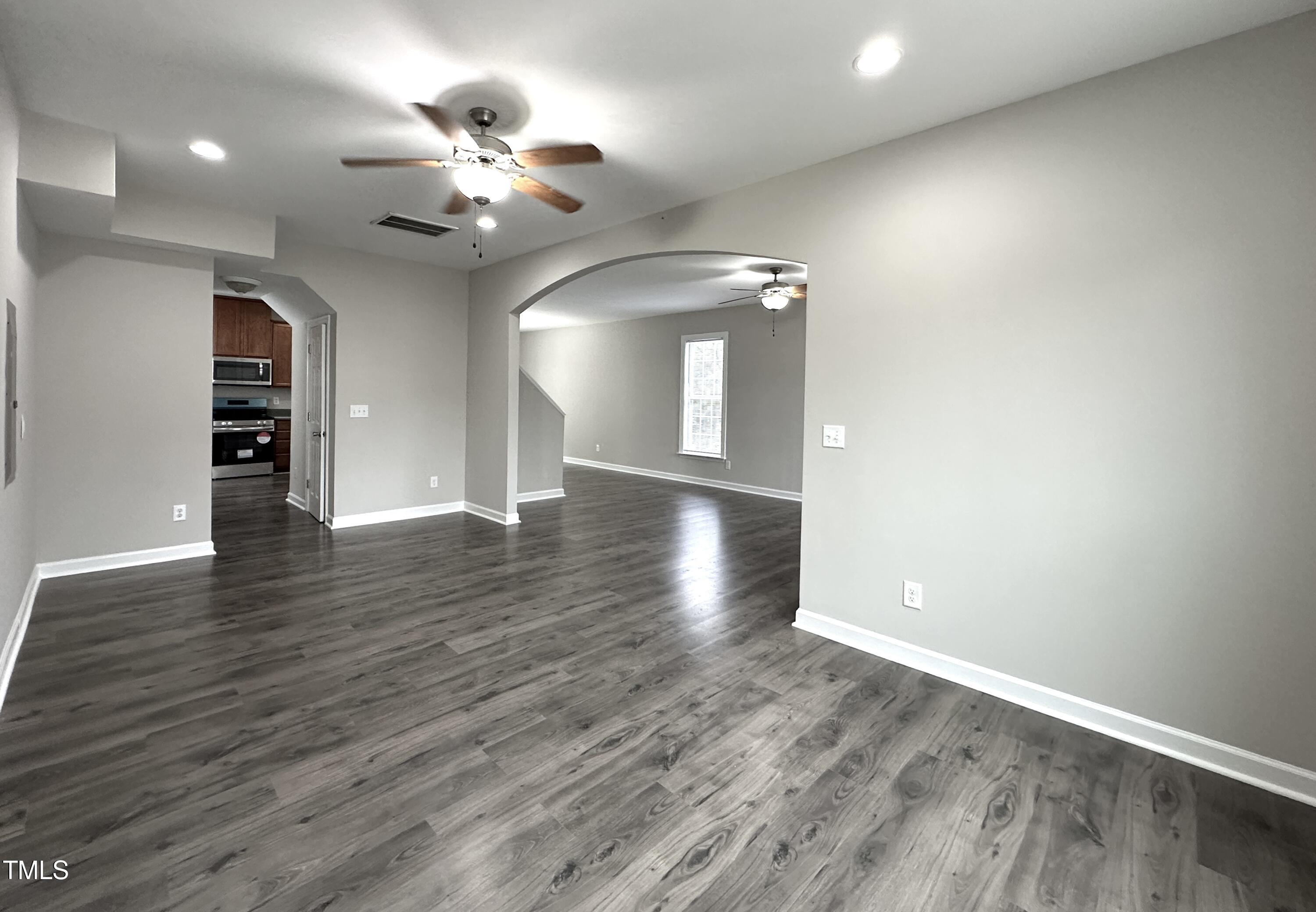 3847 Pin Oak Road Raleigh, NC 27604 - Photo 7 of 22 a view of an empty room with wooden floor