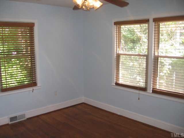 1826 Forest Road Durham, NC 27705 - Photo 11 of 12 The third bedroom is also flooded with natural light and has a ceiling fan. great closet storage and great colors will make this someones favorite room in the house!