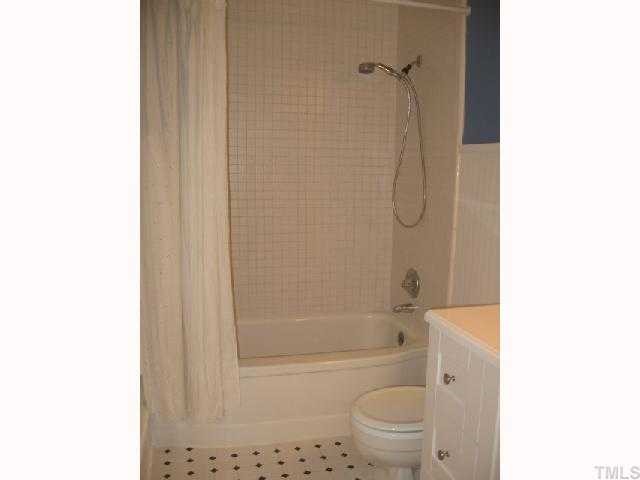 1826 Forest Road Durham, NC 27705 - Photo 8 of 12 The tub/shower has new tile and classic styling. Simple yet elegant. The bathroom has been updated and is functional, bright and clean.