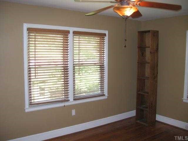 1826 Forest Road Durham, NC 27705 - Photo 9 of 12 The largest of the three bedrooms, the master, is ready to serve at your retreat. Ceiling fan, wood plantation blinds, and cool earth tone colors display elegance and calm.