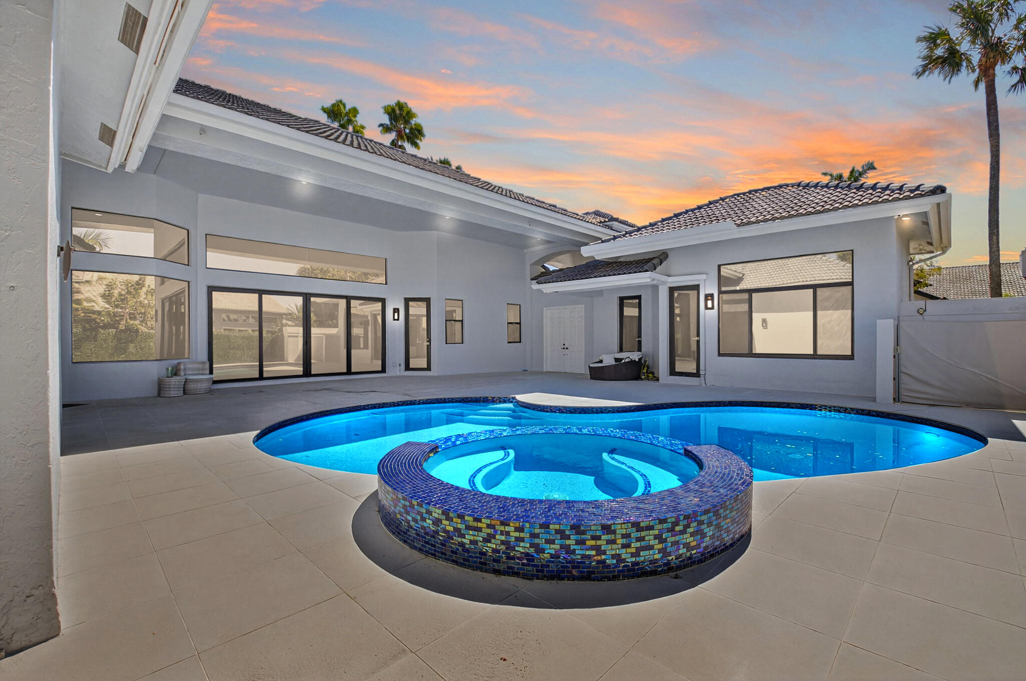 7075 Siena Court Boca Raton, FL 33433 - Photo 11 of 50 a view of a house with swimming pool and porch