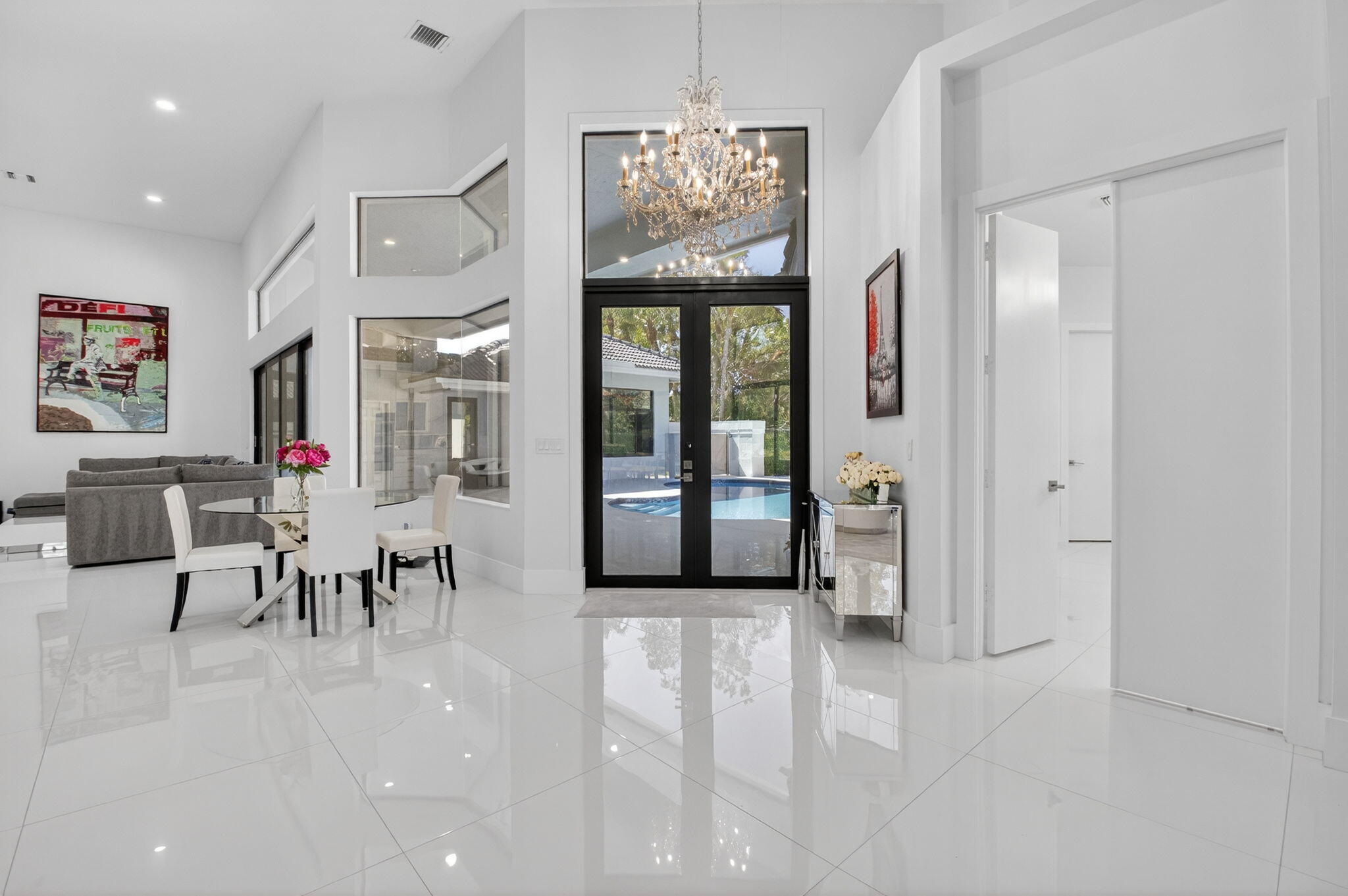 7075 Siena Court Boca Raton, FL 33433 - Photo 13 of 50 an entryway and a livingroom with furniture a chandelier