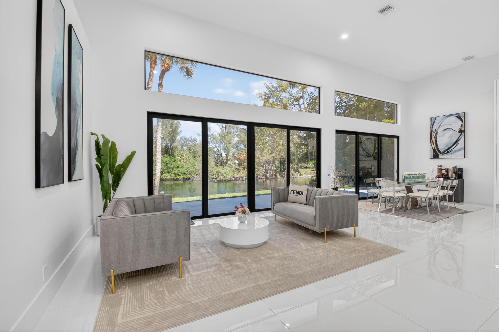 7075 Siena Court Boca Raton, FL 33433 - Photo 15 of 50 a living room with furniture and large windows
