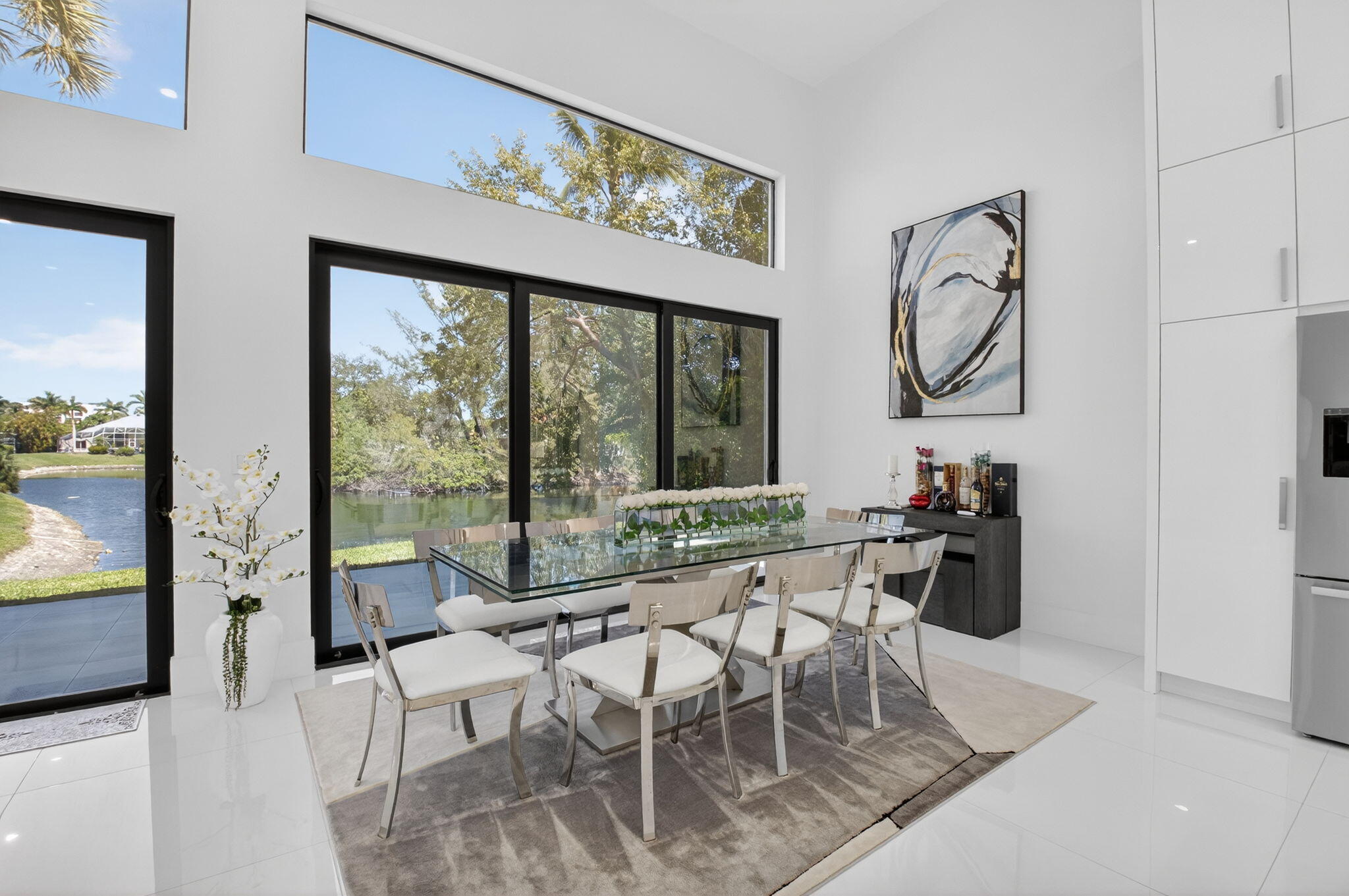7075 Siena Court Boca Raton, FL 33433 - Photo 17 of 50 a view of a dining room with furniture window and outside view