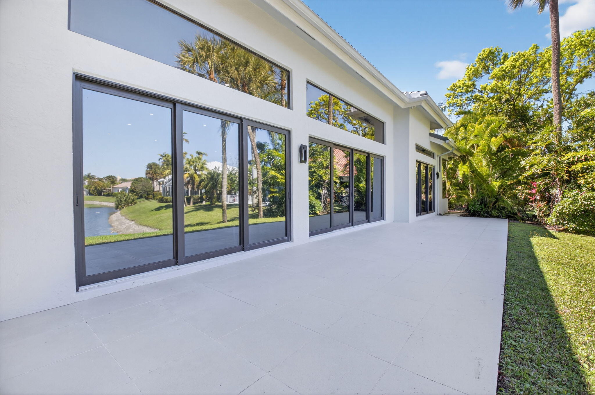 7075 Siena Court Boca Raton, FL 33433 - Photo 20 of 50 a view of an house with backyard and porch