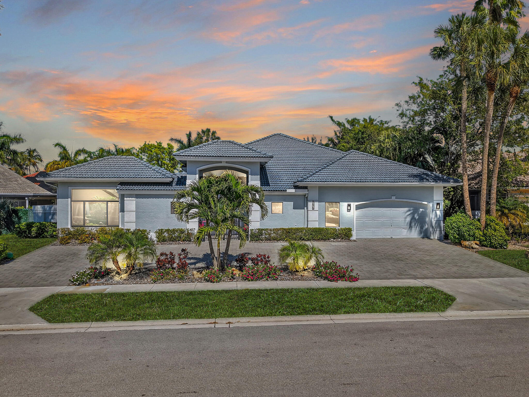 7075 Siena Court Boca Raton, FL 33433 - Photo 2 of 50 a front view of house with yard and green space
