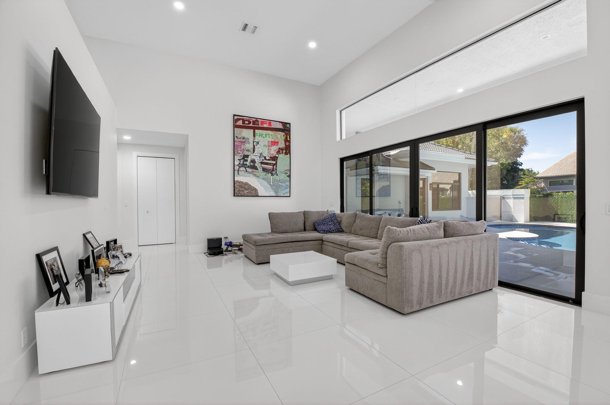 7075 Siena Court Boca Raton, FL 33433 - Photo 23 of 50 a living room with furniture and a flat screen tv