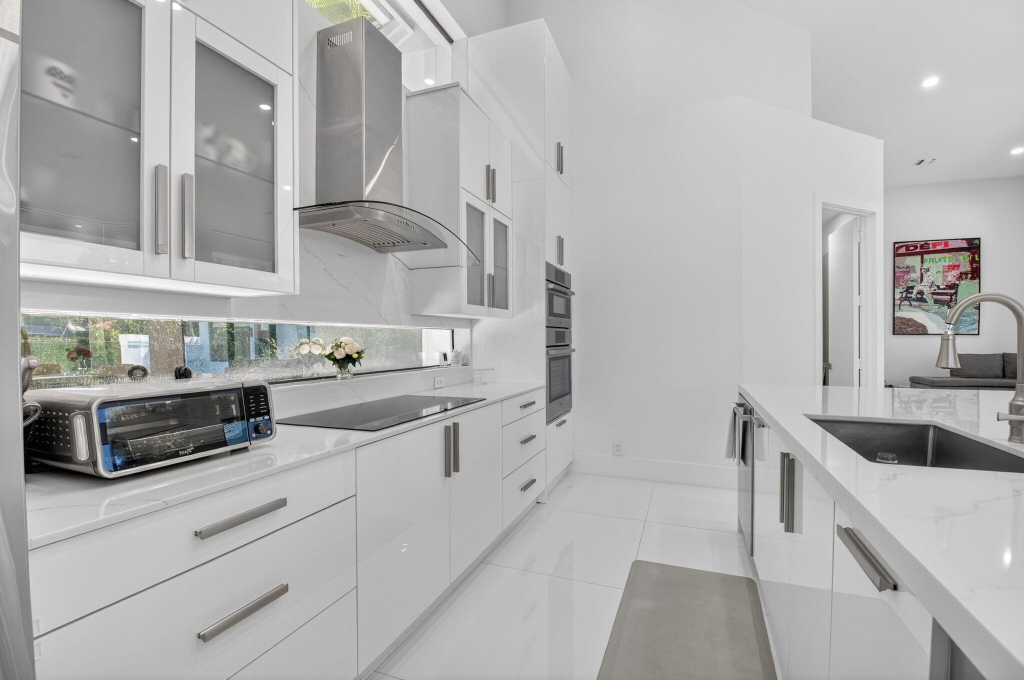 7075 Siena Court Boca Raton, FL 33433 - Photo 27 of 50 a kitchen with granite countertop a sink and cabinets