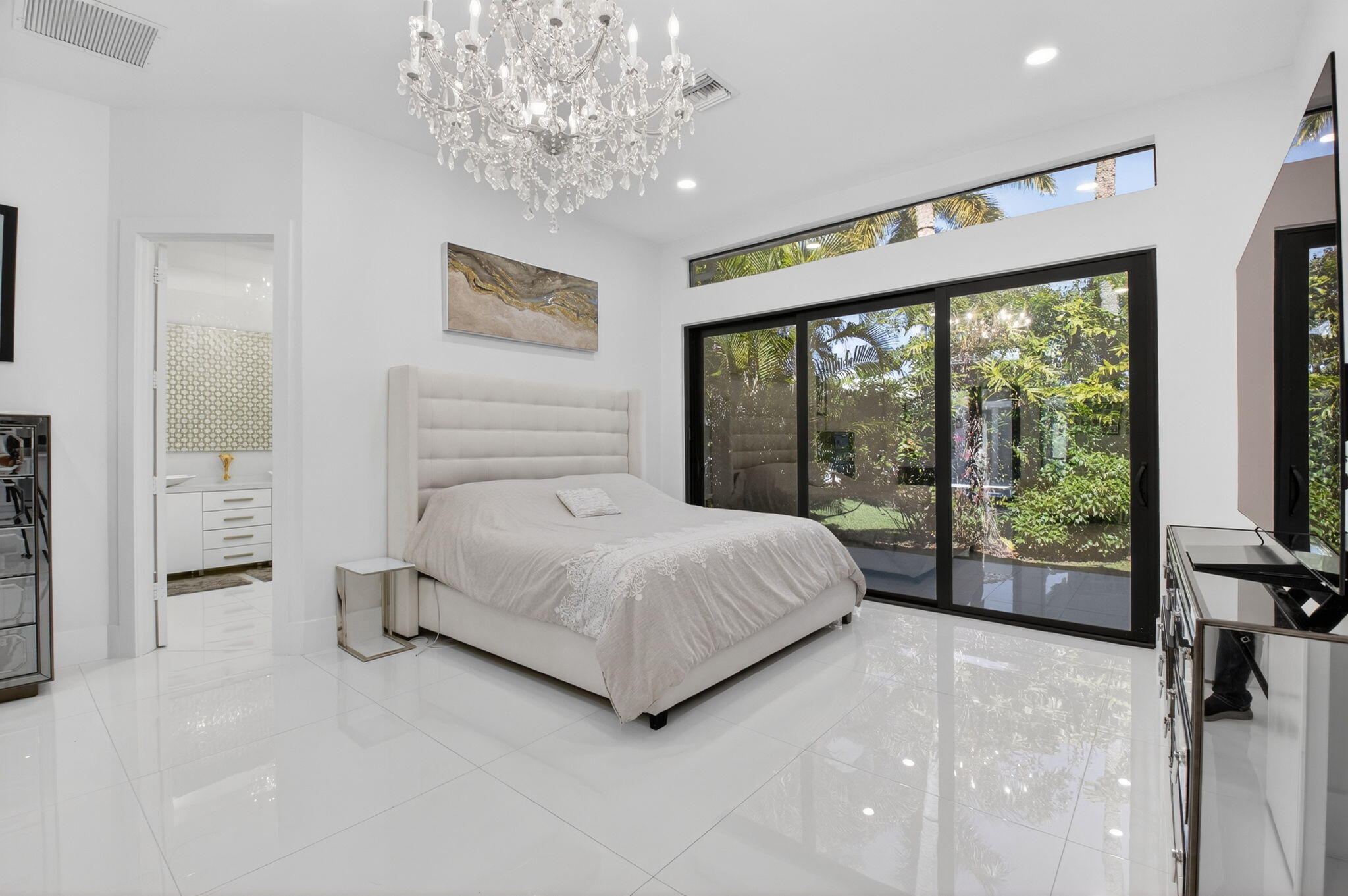 7075 Siena Court Boca Raton, FL 33433 - Photo 31 of 50 a spacious bedroom with a large bed and a large window