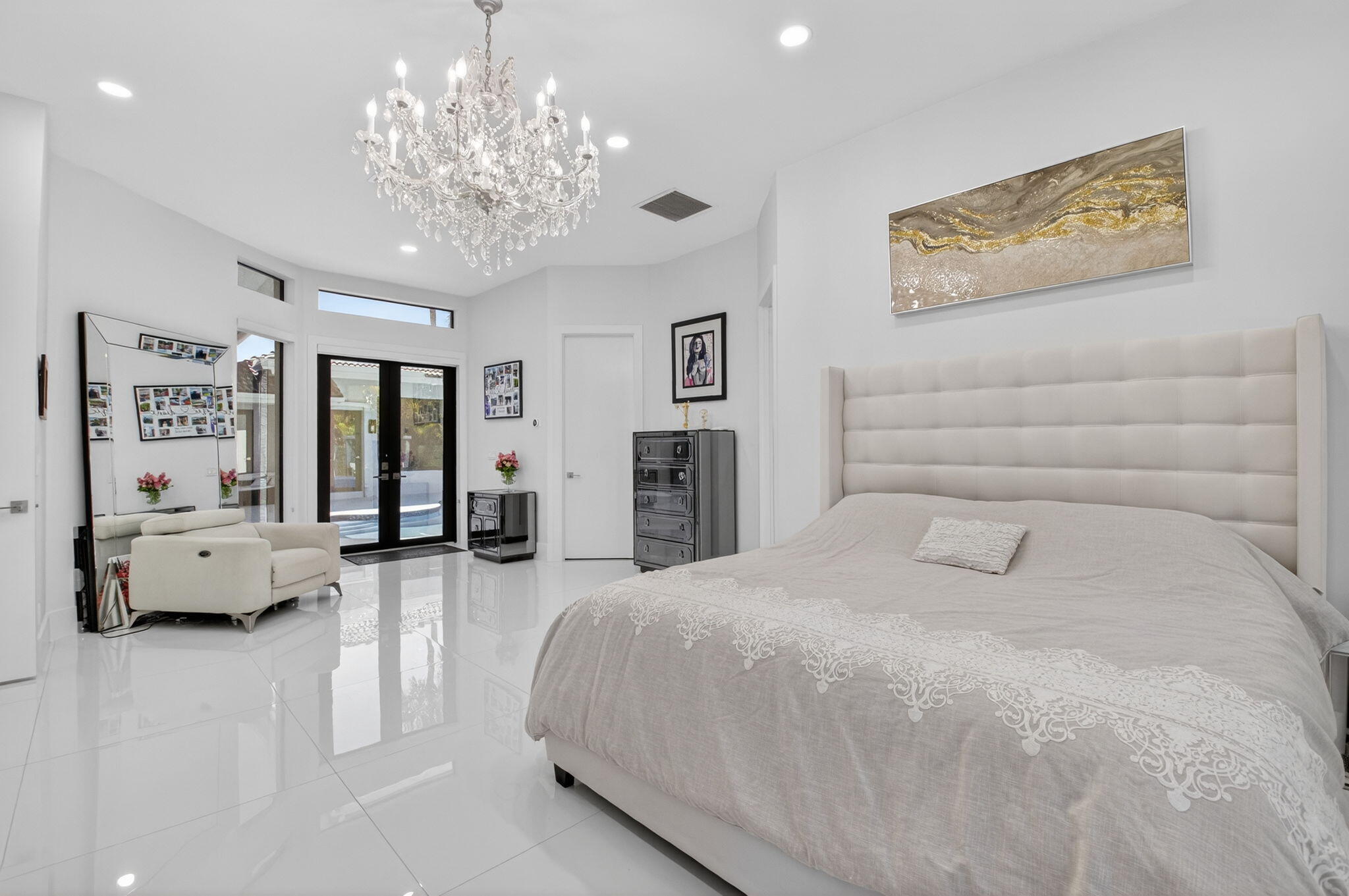 7075 Siena Court Boca Raton, FL 33433 - Photo 32 of 50 a spacious bedroom with a bed couch and window