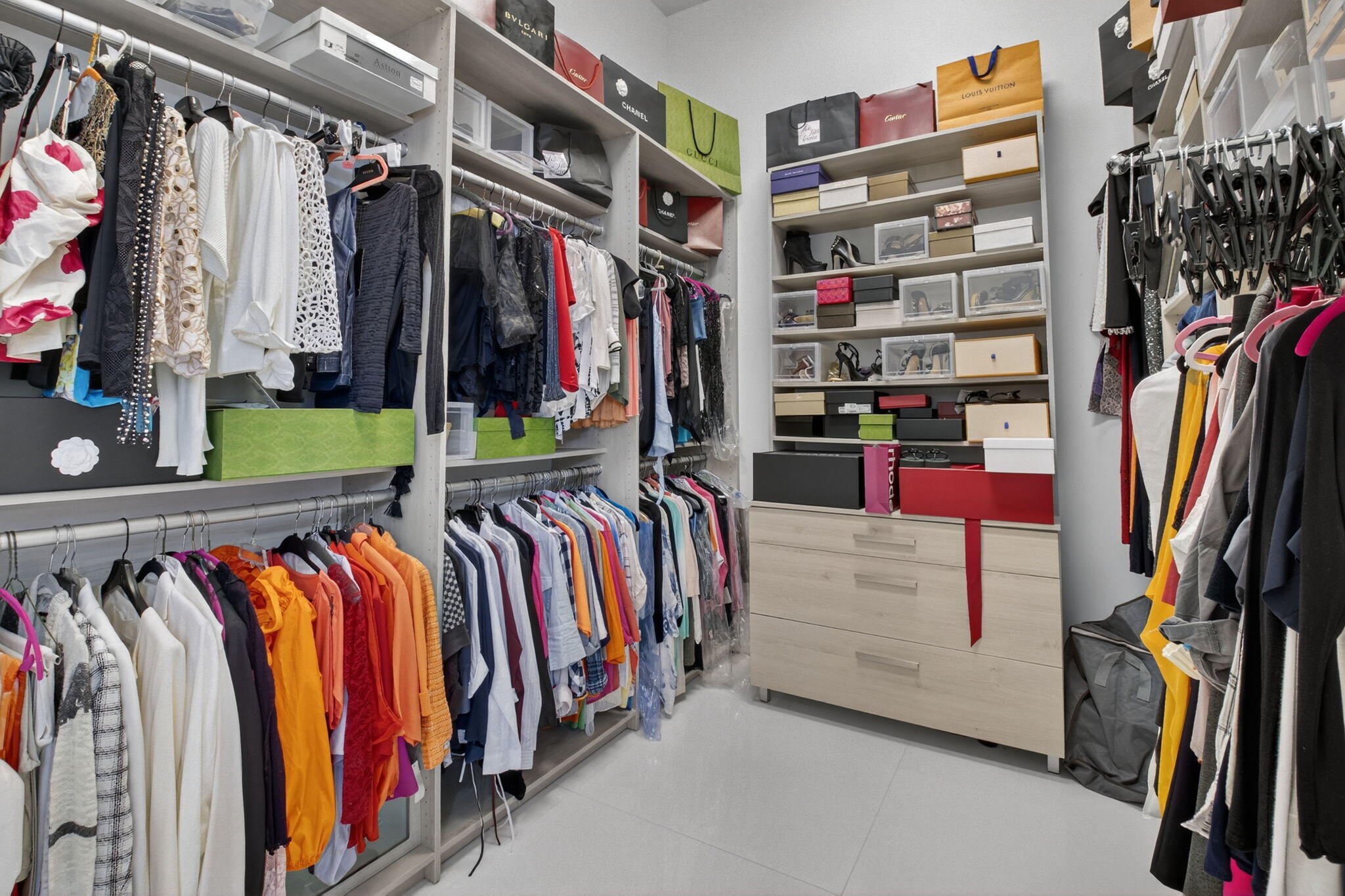 7075 Siena Court Boca Raton, FL 33433 - Photo 33 of 50 a view of walk in closet with clothes and shoes