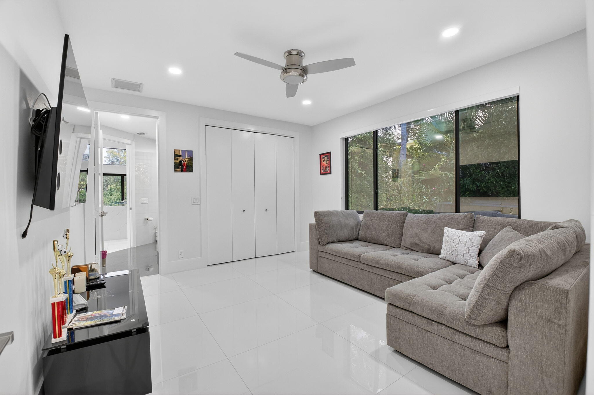 7075 Siena Court Boca Raton, FL 33433 - Photo 36 of 50 a living room with furniture and a flat screen tv