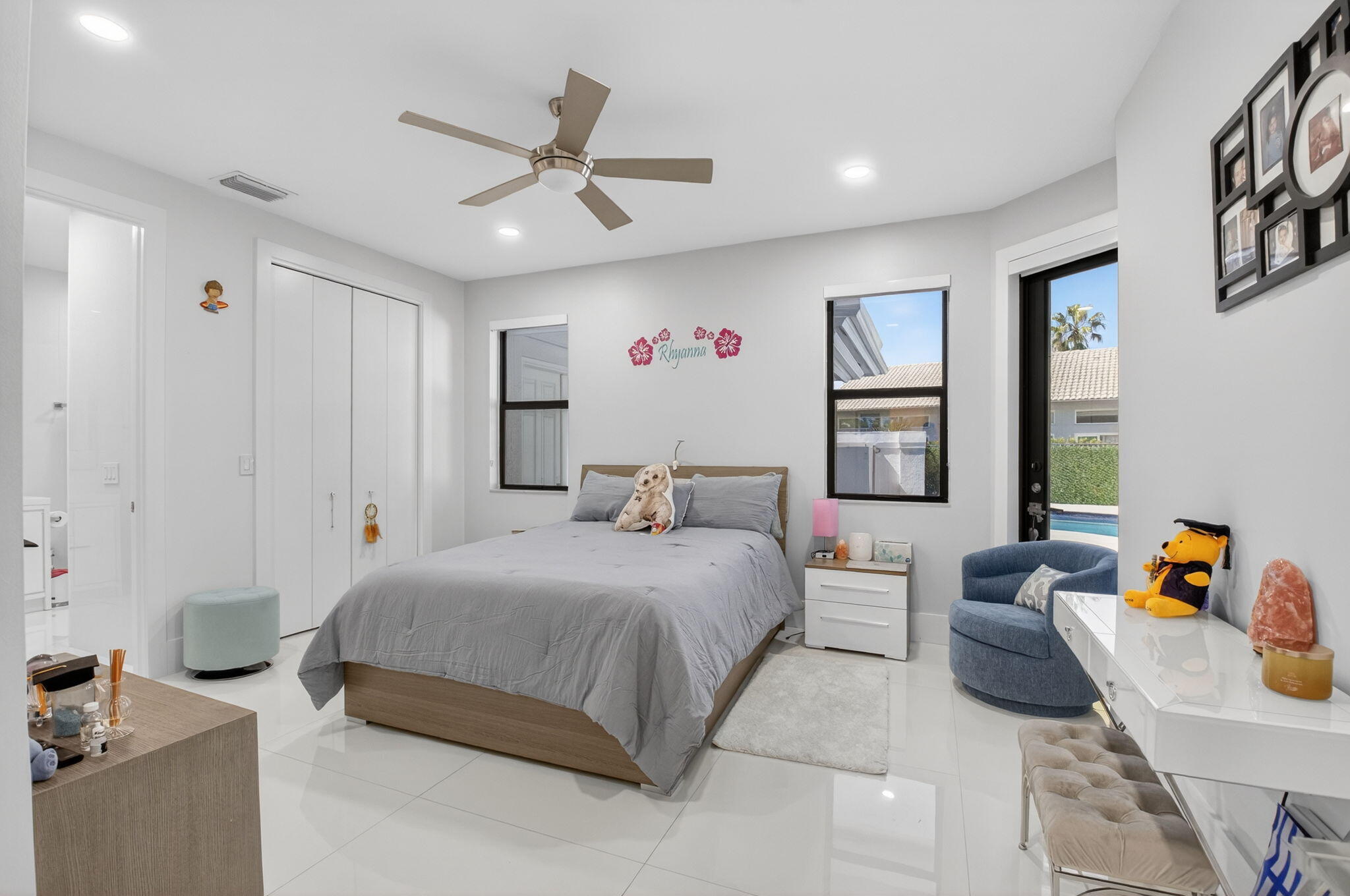 7075 Siena Court Boca Raton, FL 33433 - Photo 38 of 50 a bedroom with a bed and ceiling fan
