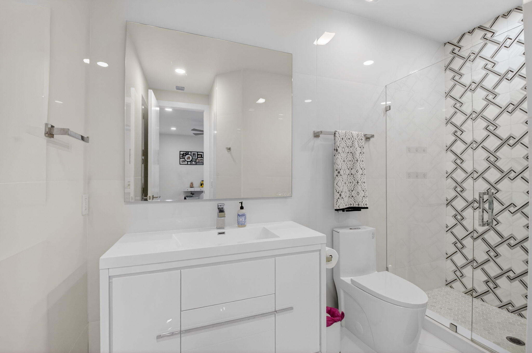7075 Siena Court Boca Raton, FL 33433 - Photo 39 of 50 a bathroom with a sink toilet and shower